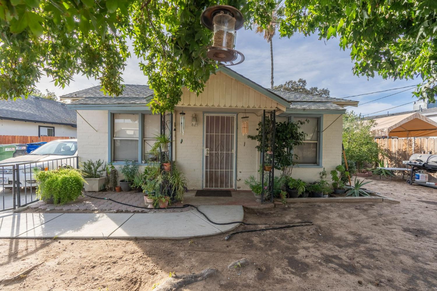 a front view of a house with garden