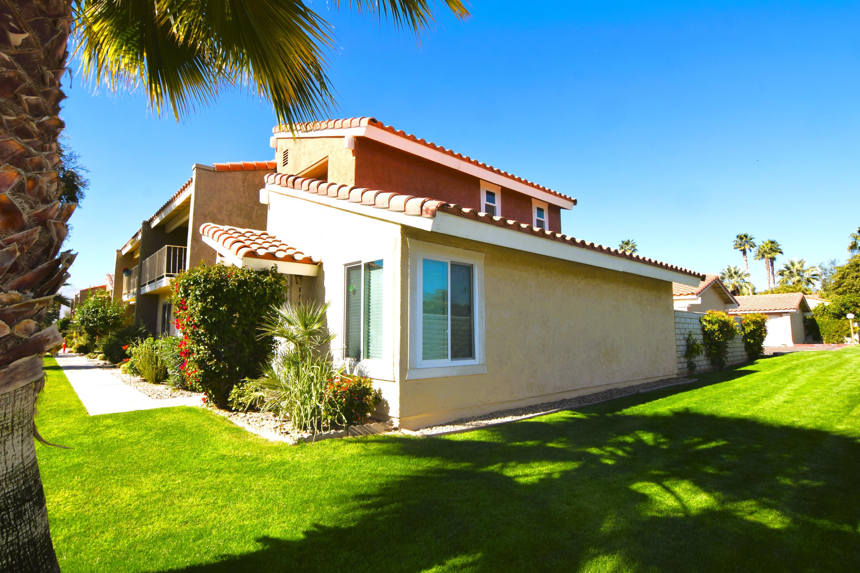 a view of a house with a yard