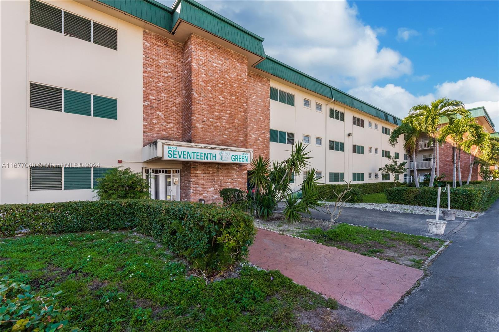 a view of a building with a yard