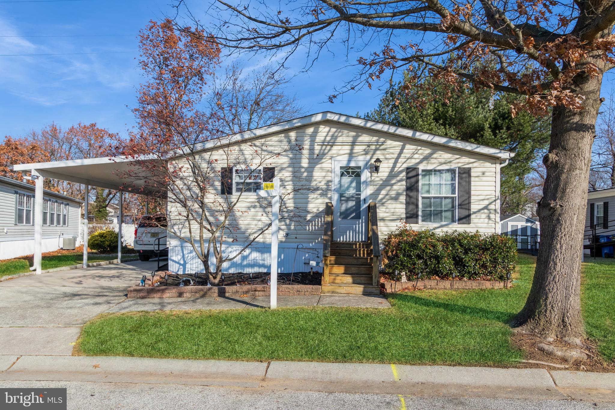 a view of a house with a backyard