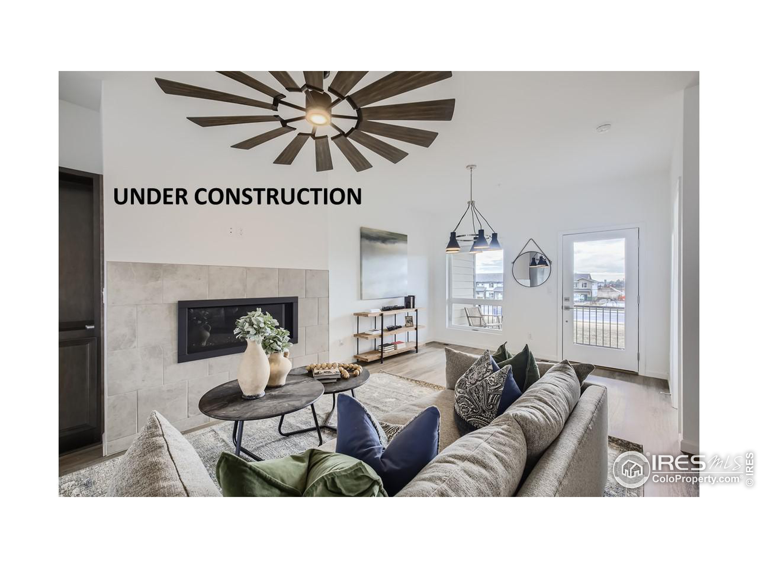 a living room with furniture and a chandelier