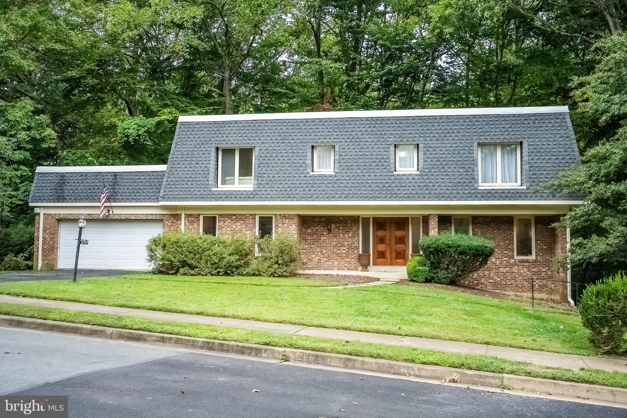 Modern French-Style Mansard Roof Colonial