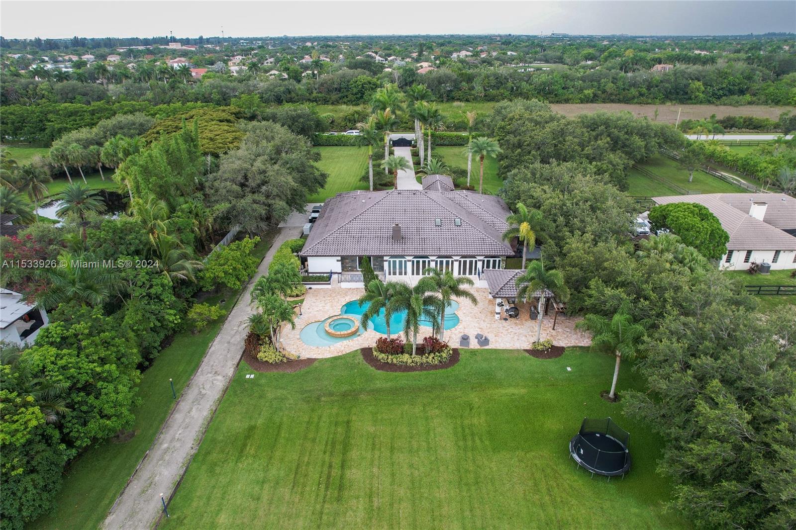 an aerial view of a house with garden space lake view and mountain view