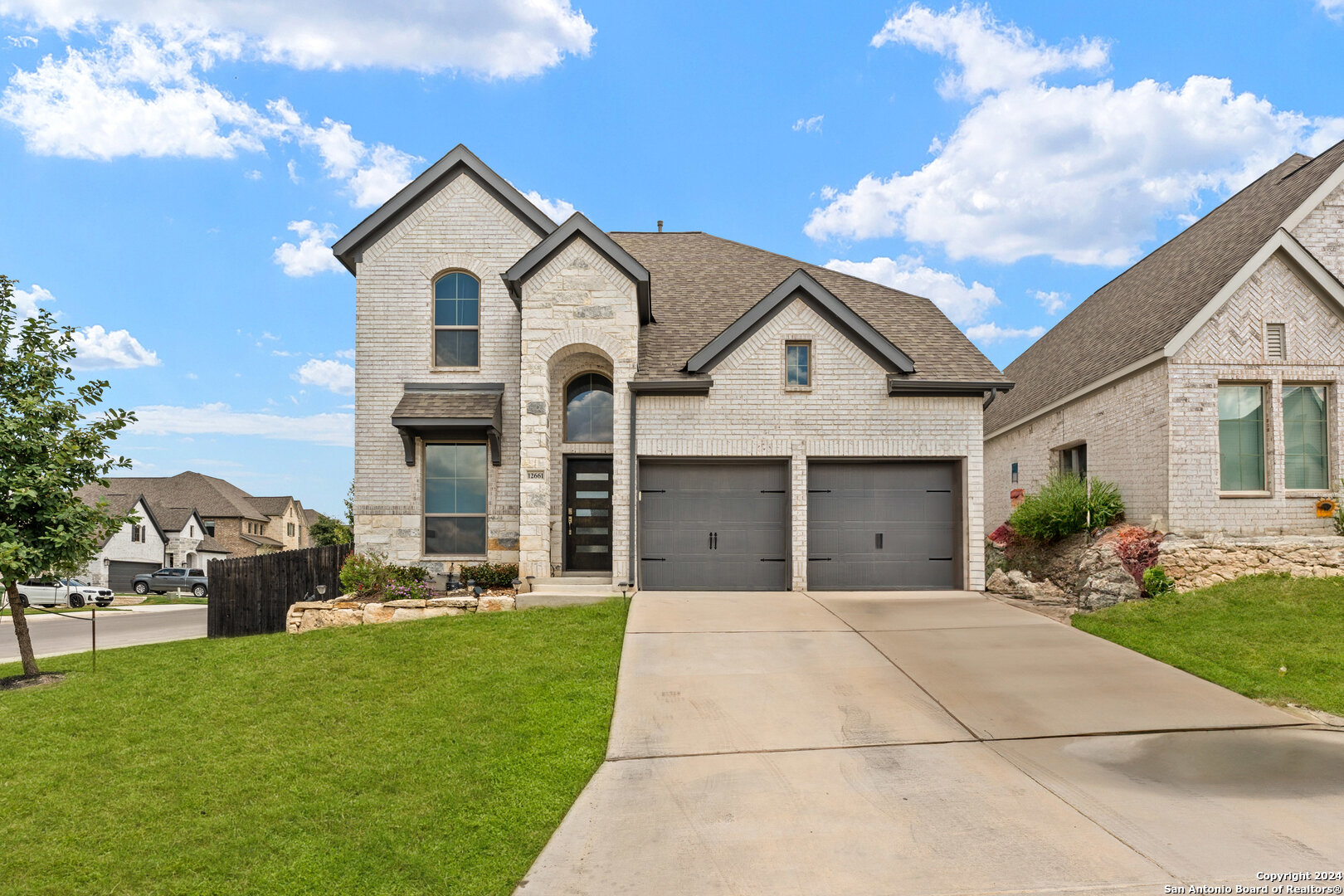 a front view of a house with a yard