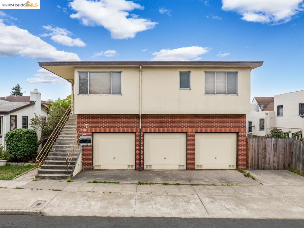 a front view of a house with a garage