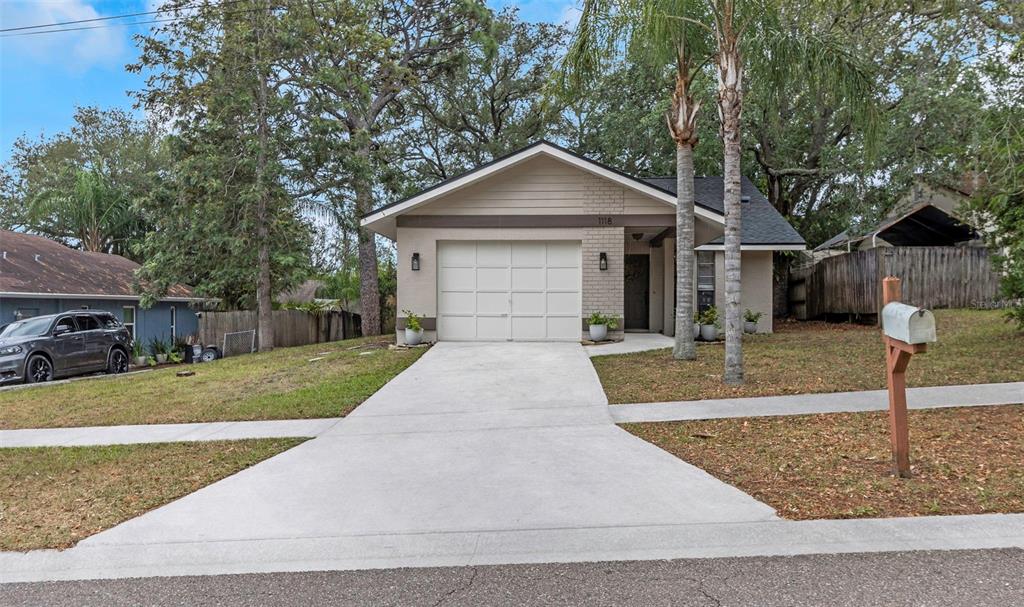 front view of a house with a yard