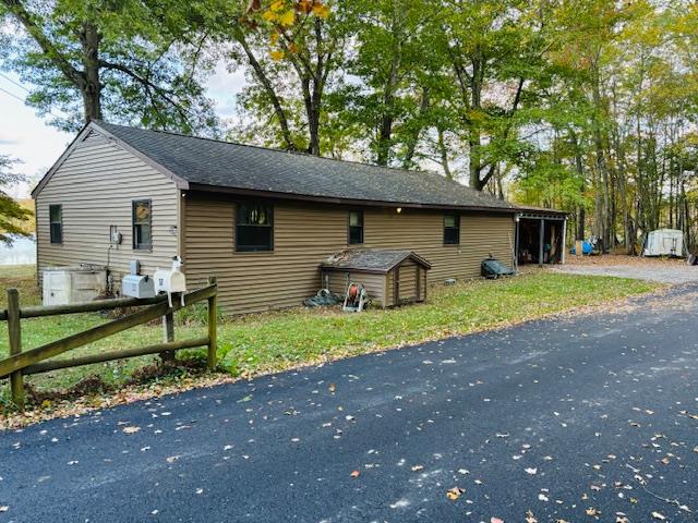 View of front facade featuring a storage shed