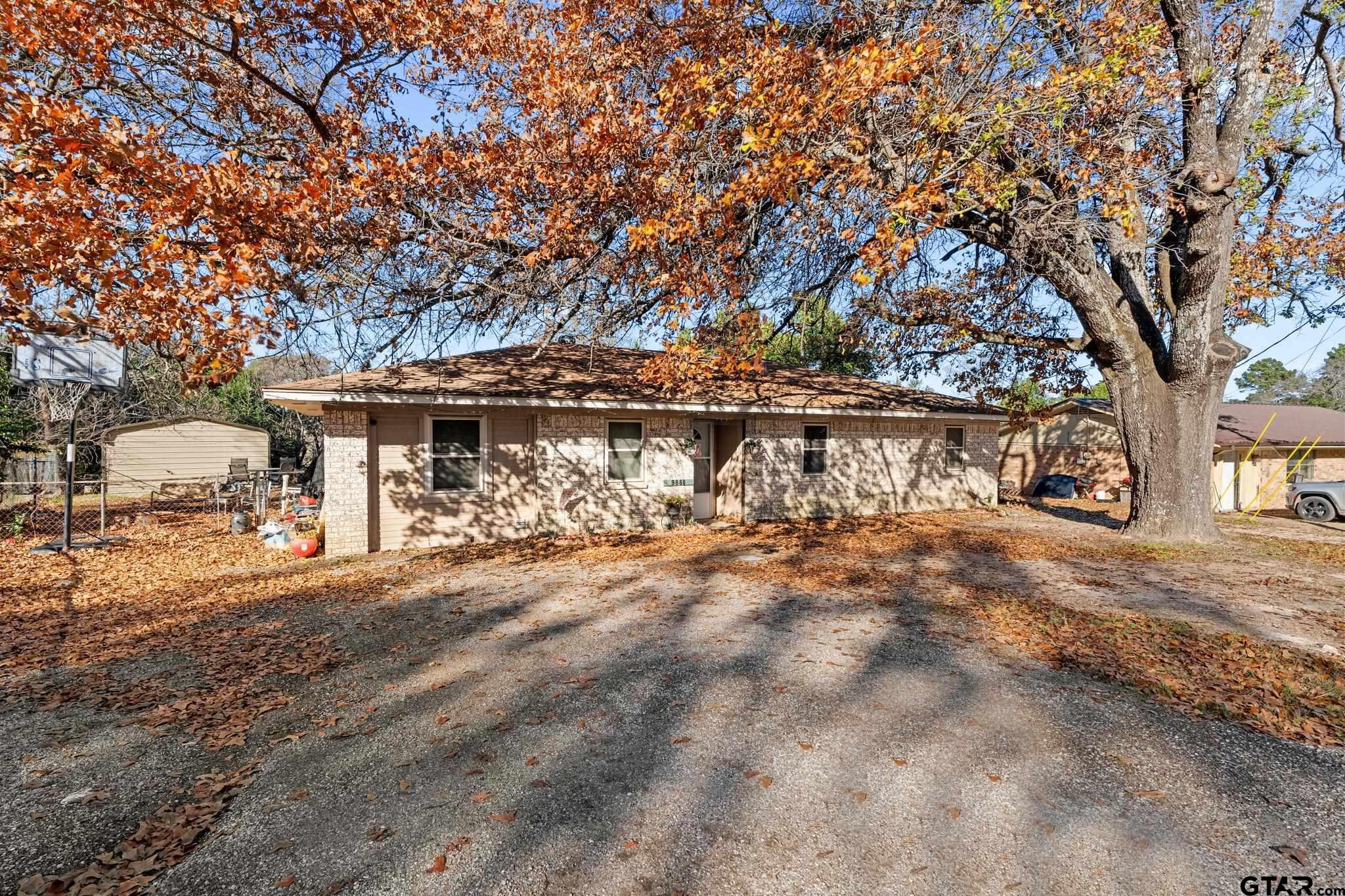 a view of house with outdoor space and sitting area