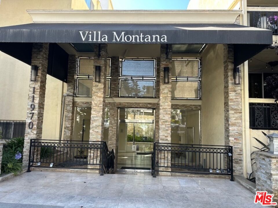 a view of a building with a door and a window