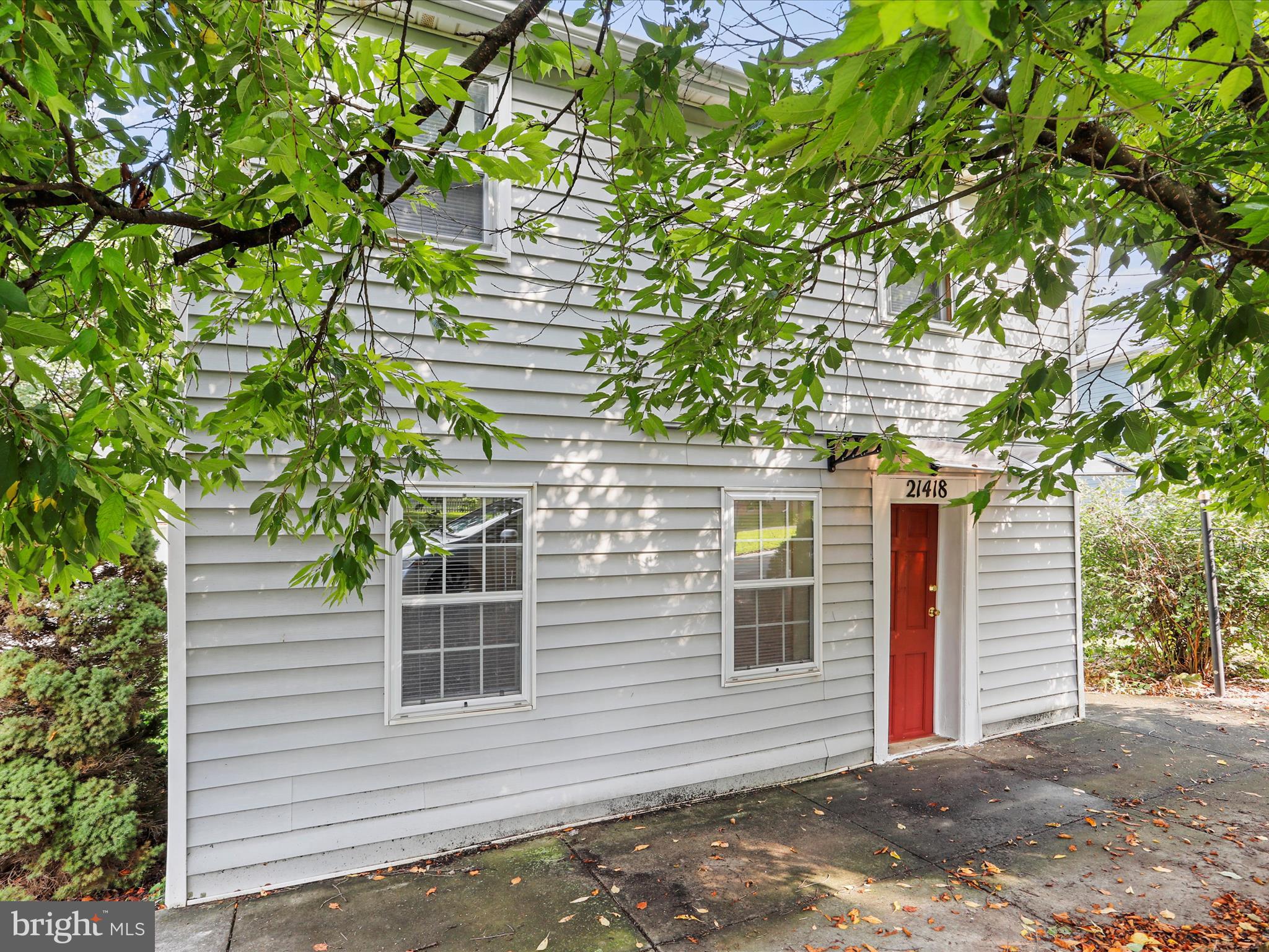 a view of a house with a tree