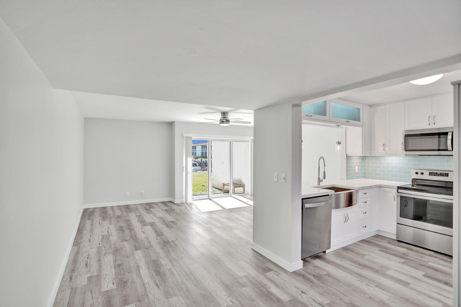 a kitchen with stainless steel appliances a refrigerator and a stove top oven