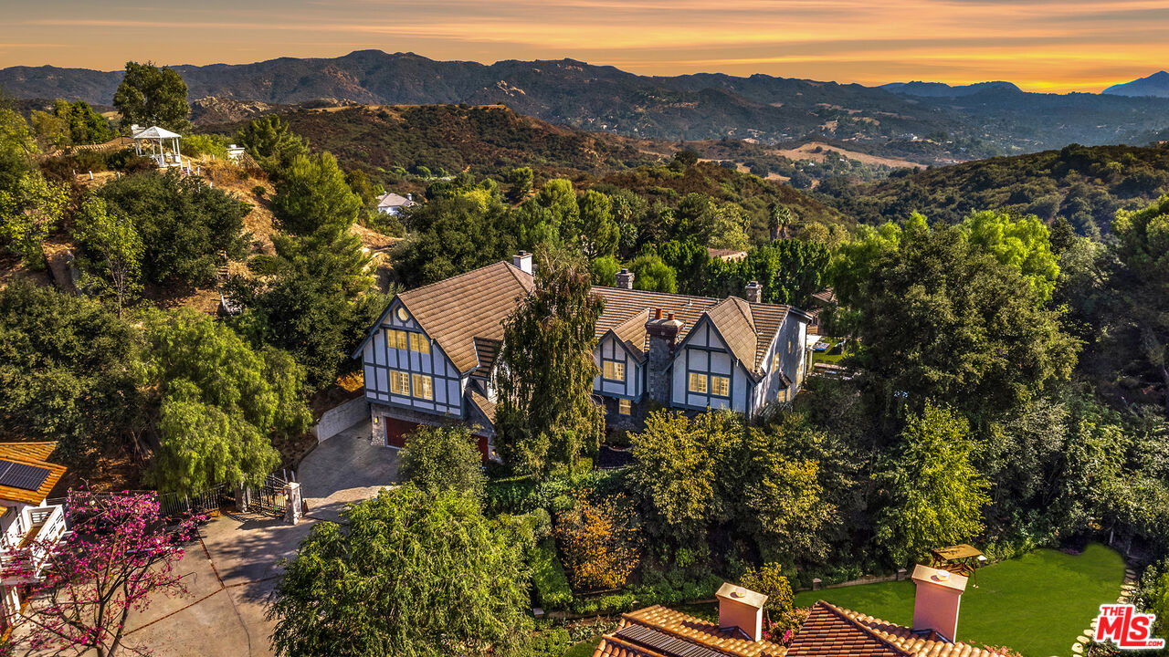 an aerial view of a house with a garden