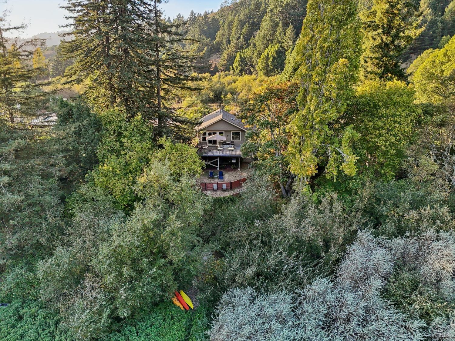 a aerial view of a house with a yard