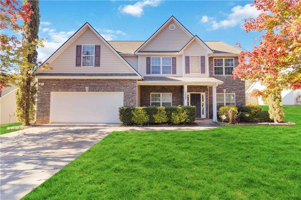 a front view of a house with a yard