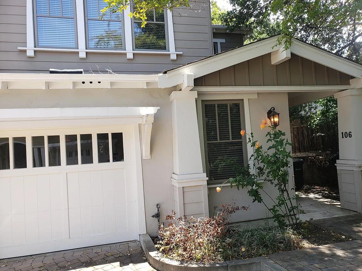 a front view of a house with garden