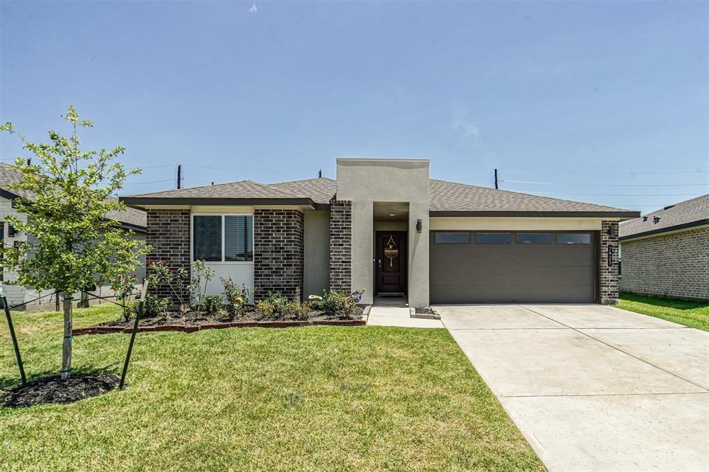 a front view of a house with yard