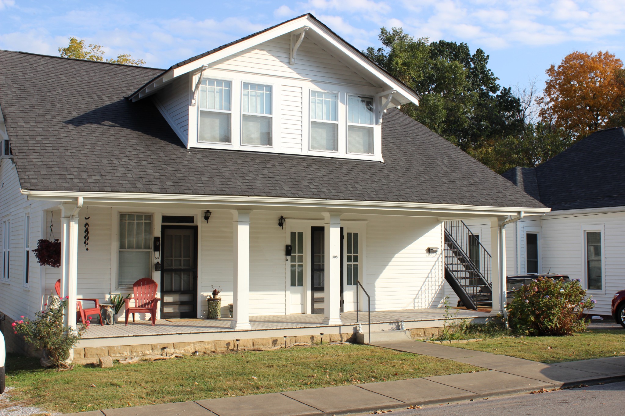 a front view of a house with garden