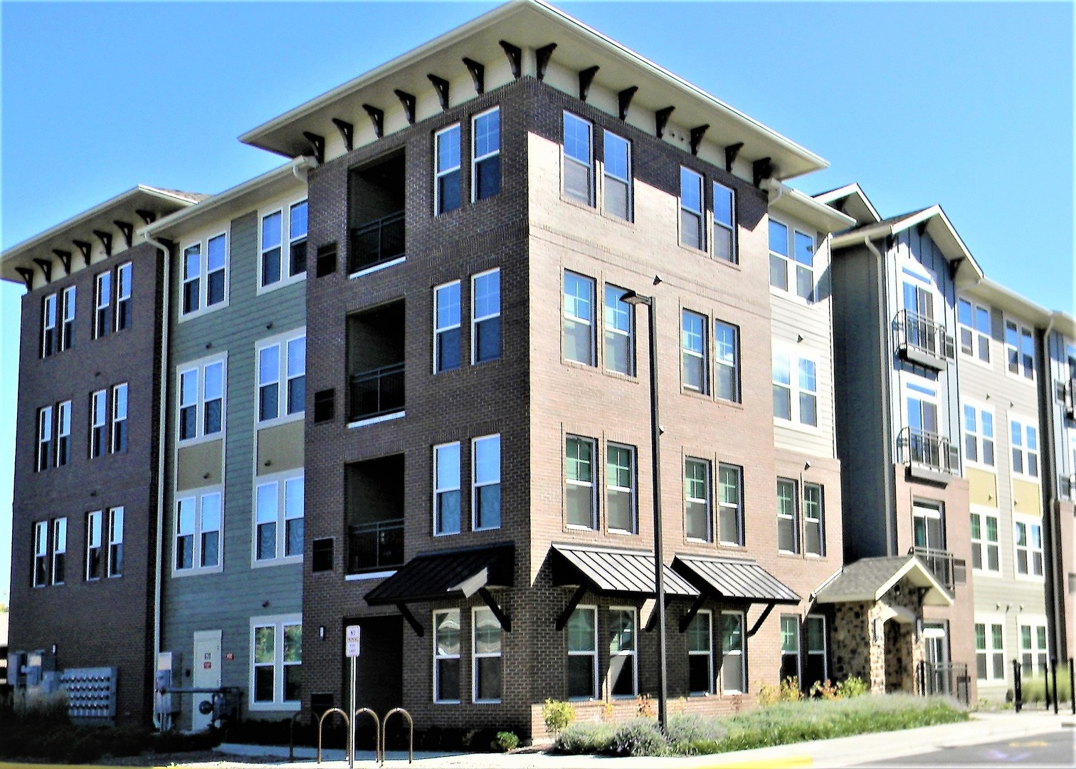 a front view of a building with lot of windows