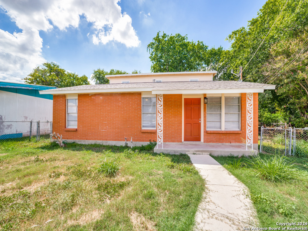 front view of a house with a yard