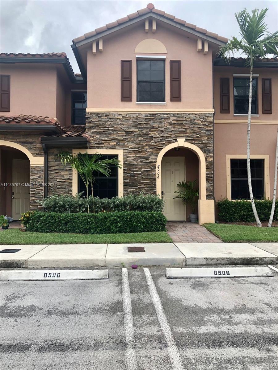 a front view of a house with yard