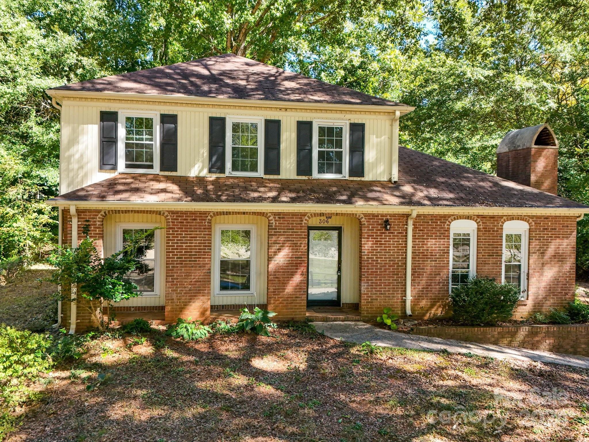 front view of a house with a yard