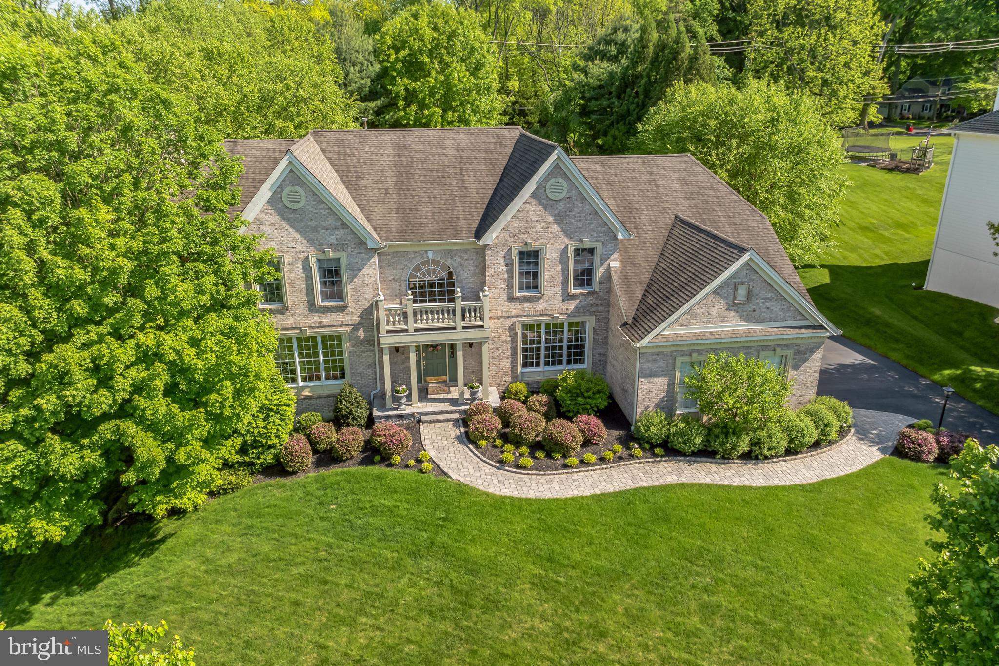 a aerial view of a house with a yard table and chairs