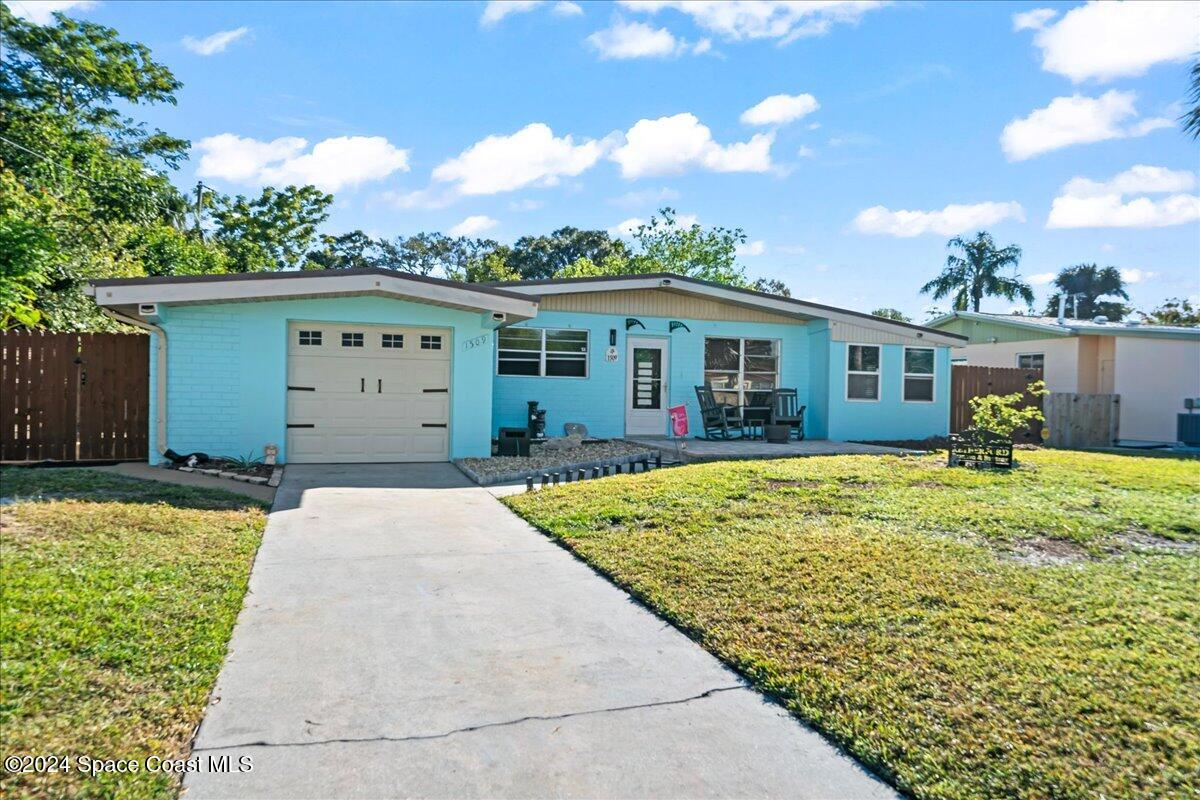 front view of a house with a yard