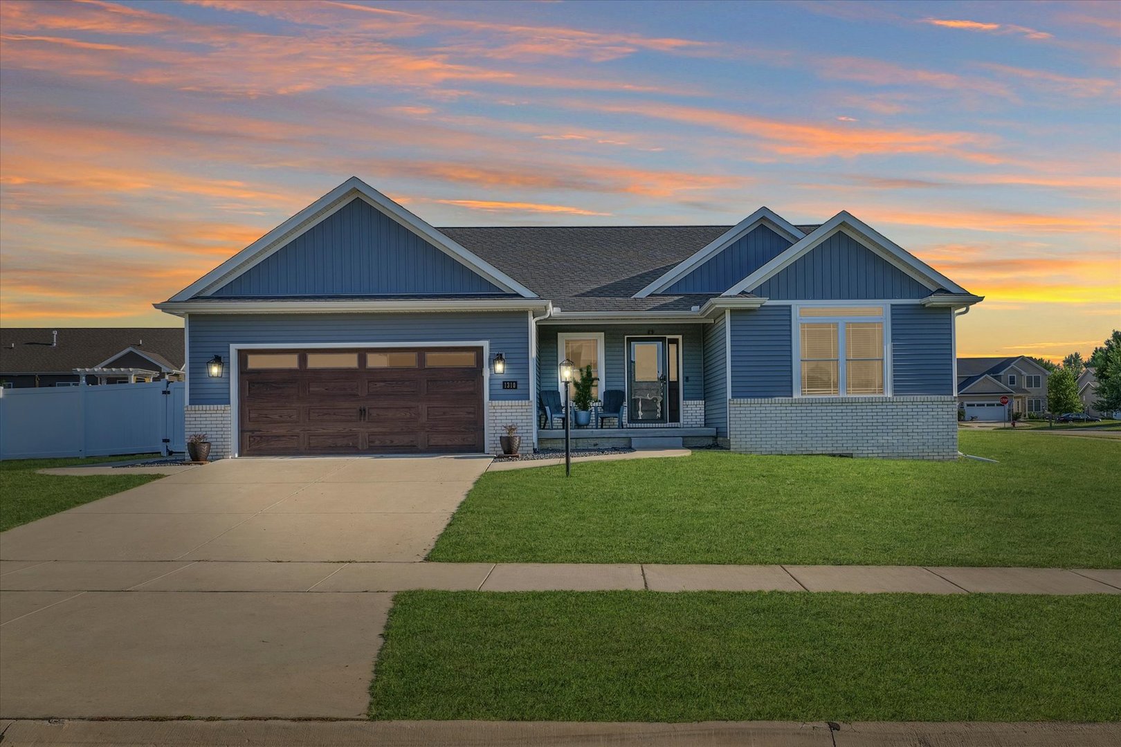 a front view of a house with a garden