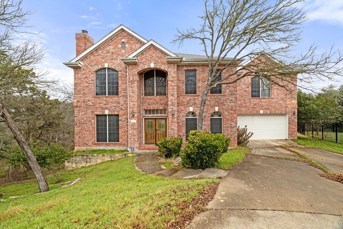 front view of a house with a yard