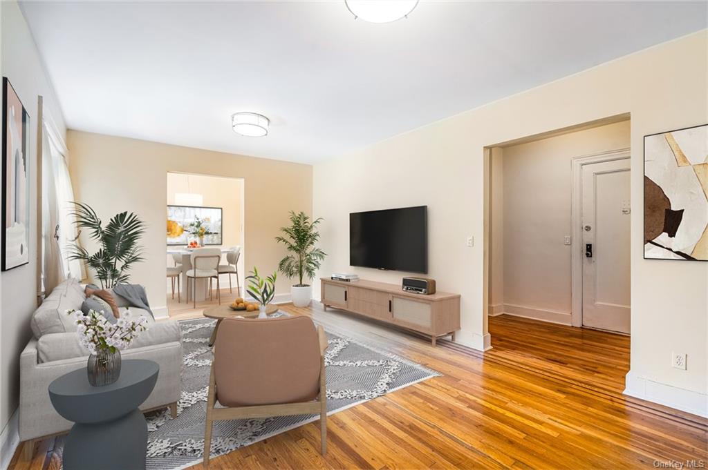 Living room with wood-type flooring