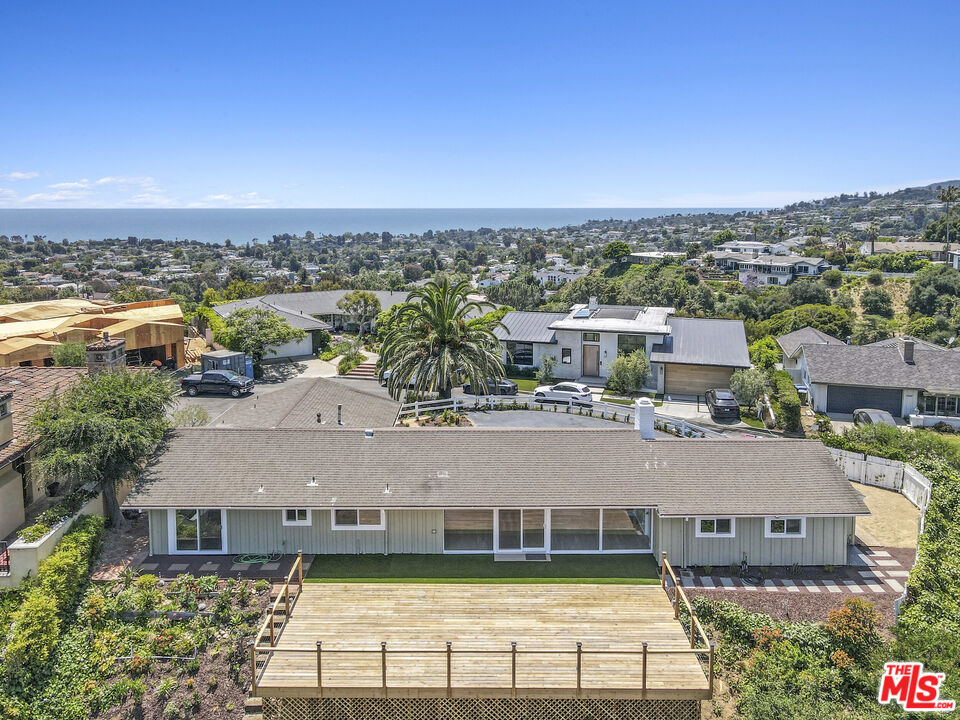 an aerial view of a house with a garden