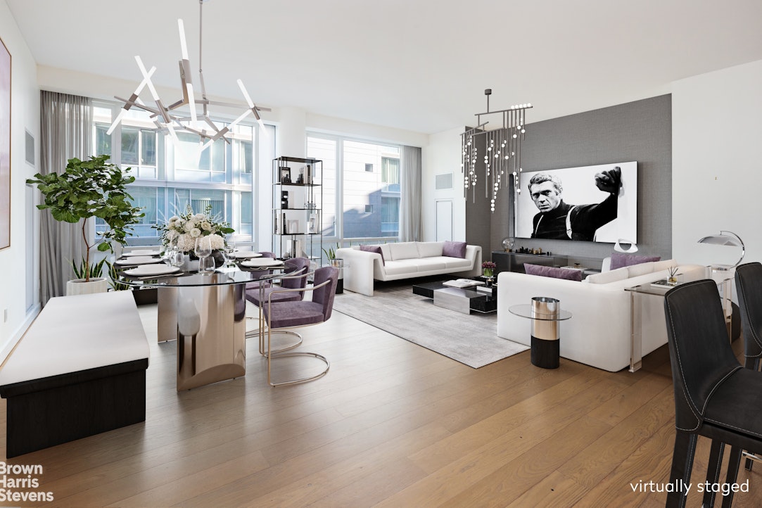 a living room with fireplace furniture and a chandelier