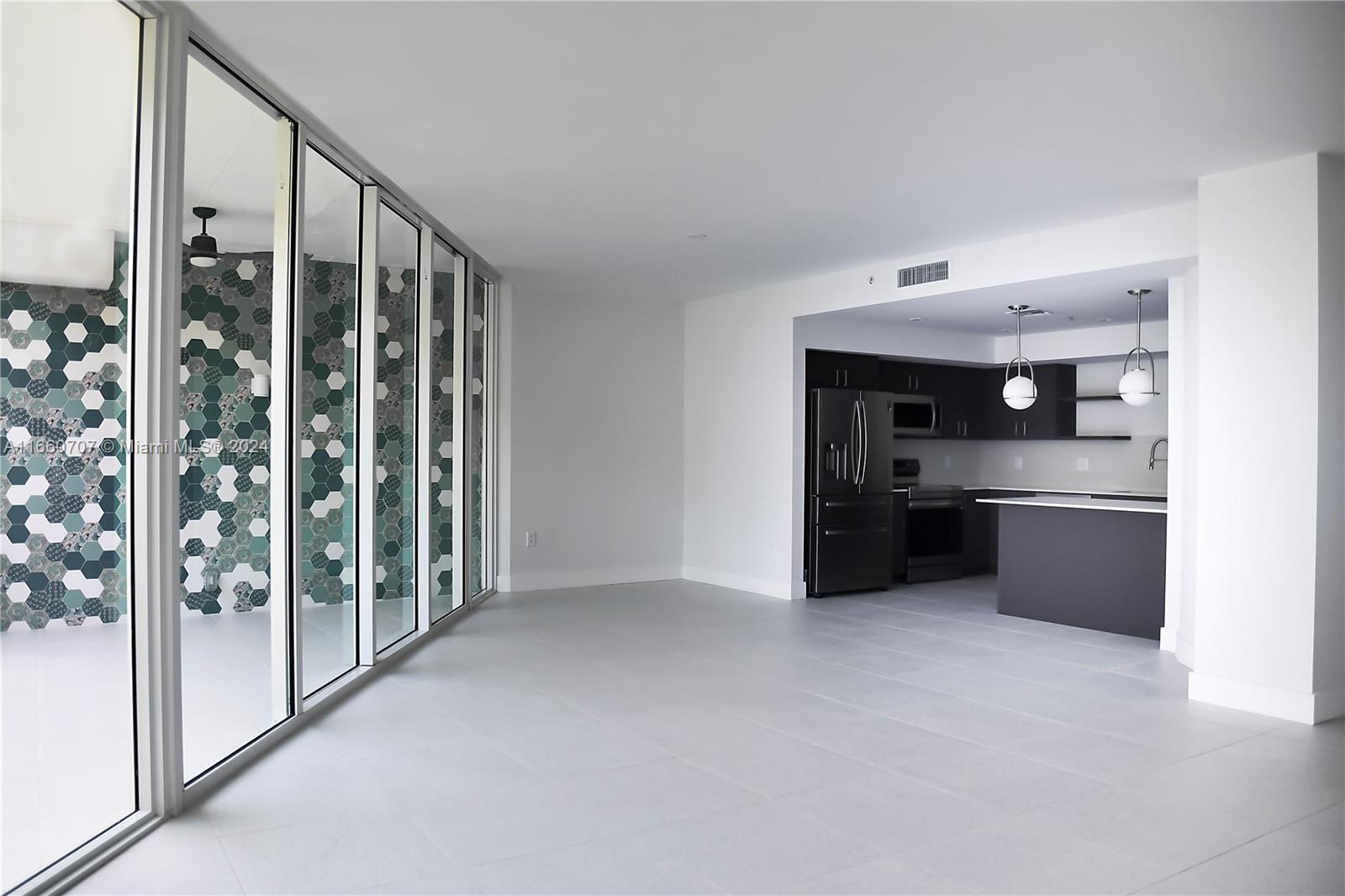 a kitchen with stainless steel appliances a refrigerator and a sink