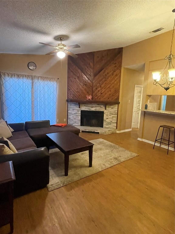 family room with stacked tile  and cedar fireplace