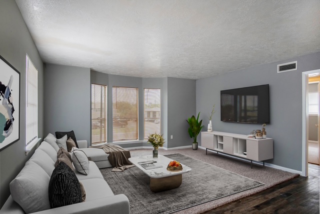 Living room featuring a textured ceiling and dark