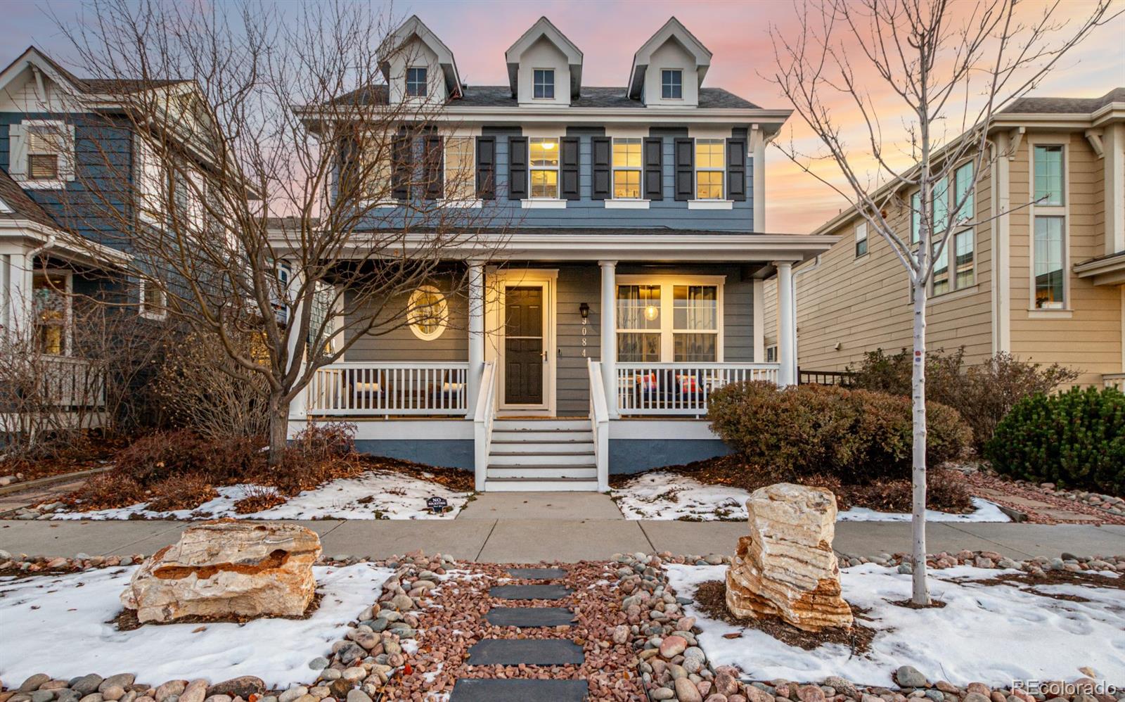 a front view of a house with a yard