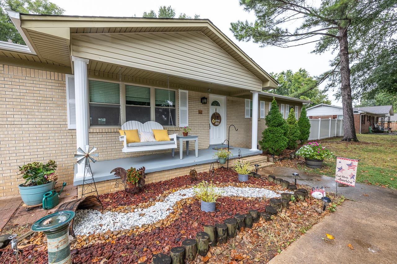 a front view of house with outdoor seating