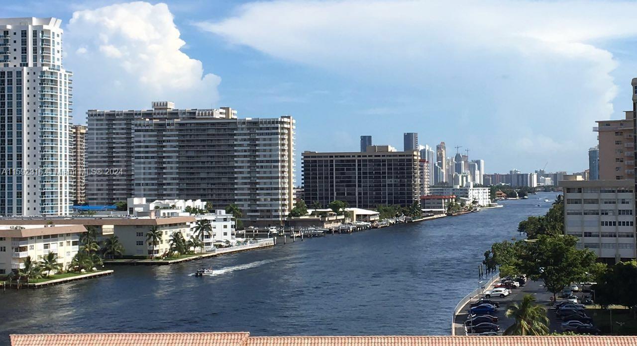 a view of a city with tall buildings