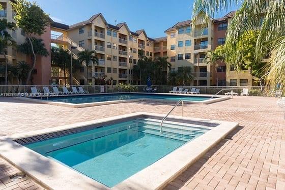 a view of a building with a swimming pool