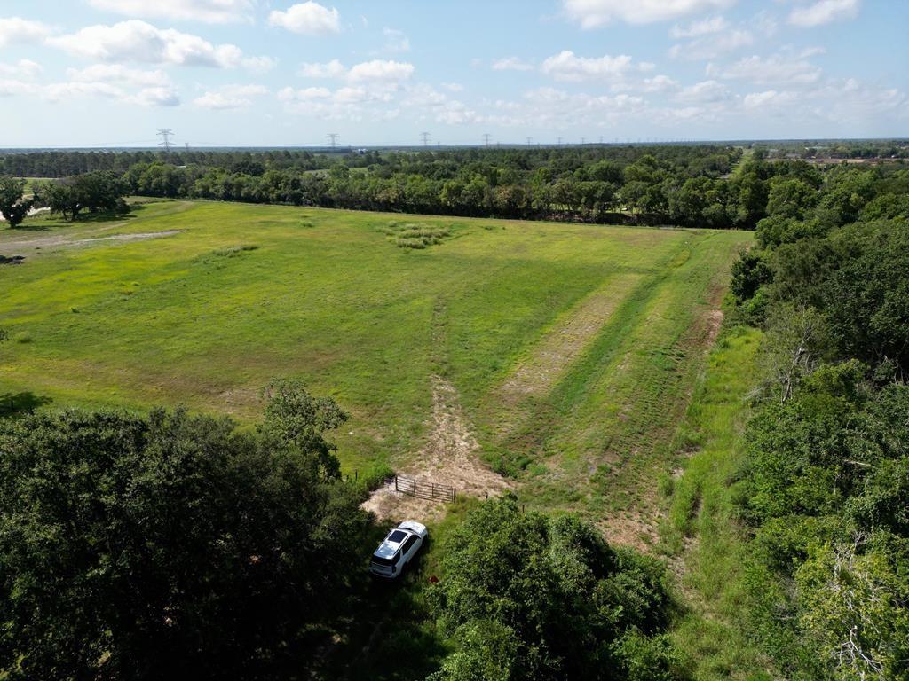 a view of a field with an ocean