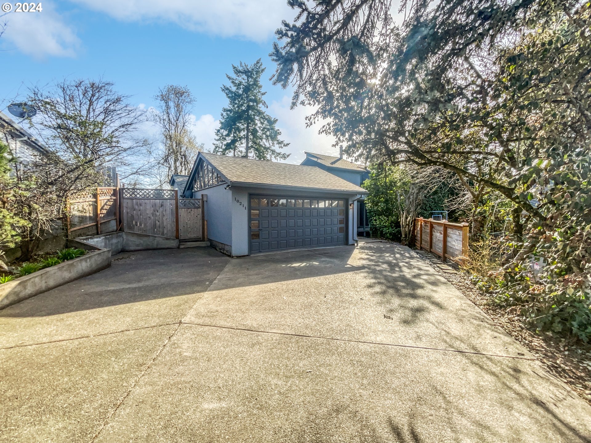 a view of a house with a yard and garage