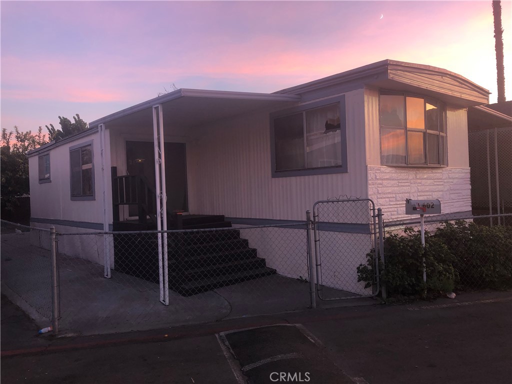 a front view of a house with parking space