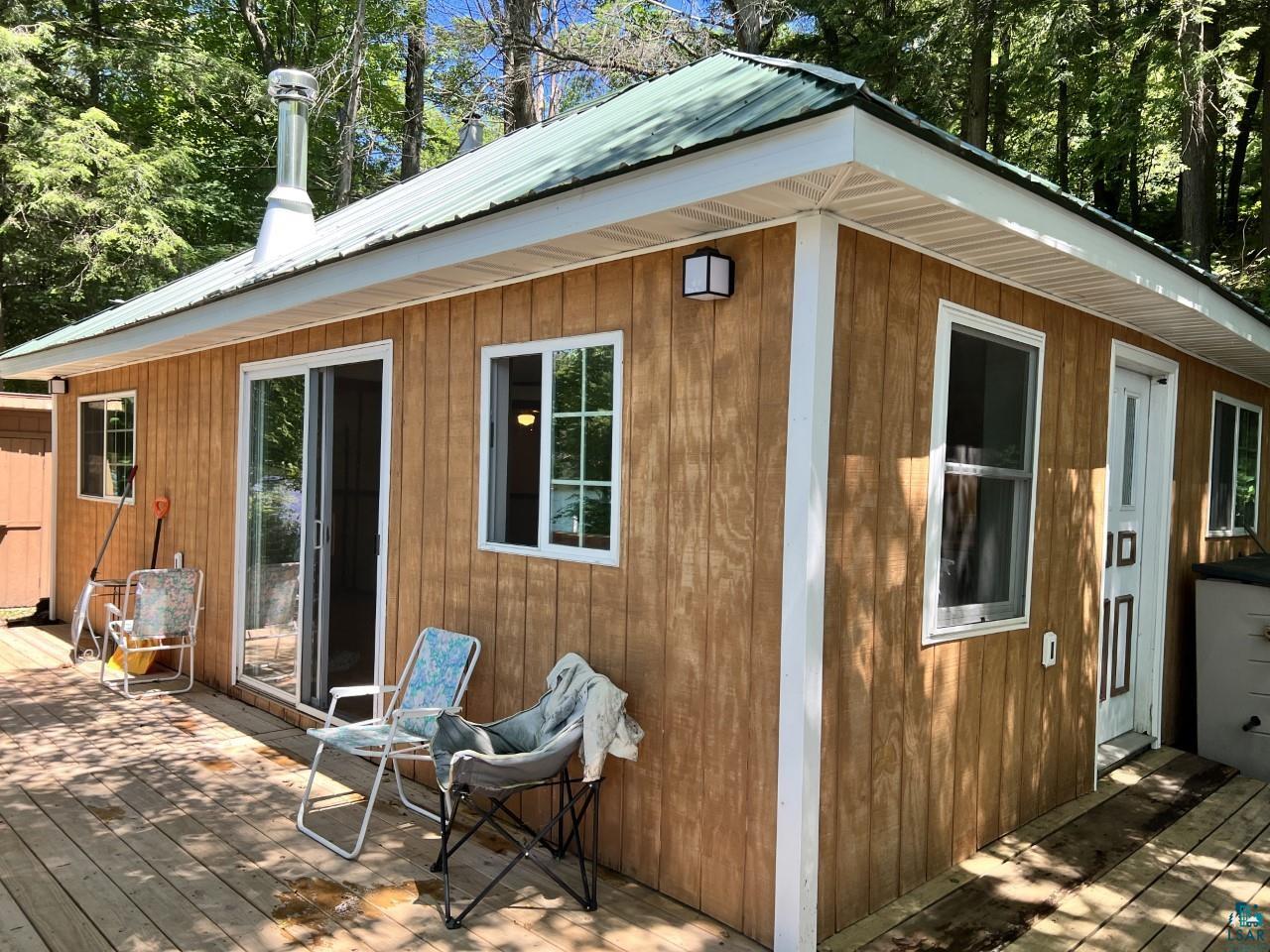 View of property exterior featuring a deck