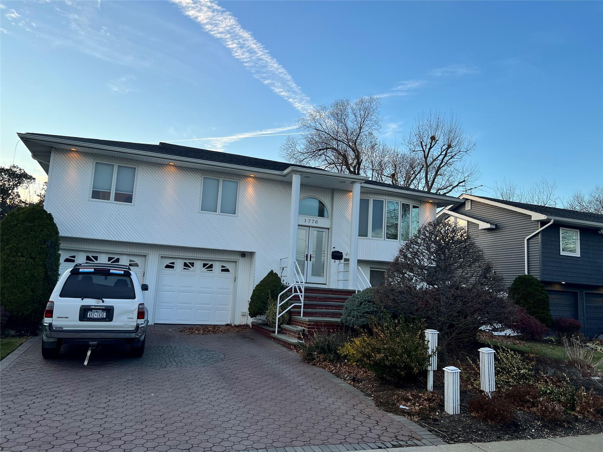 Bi-level home featuring a garage