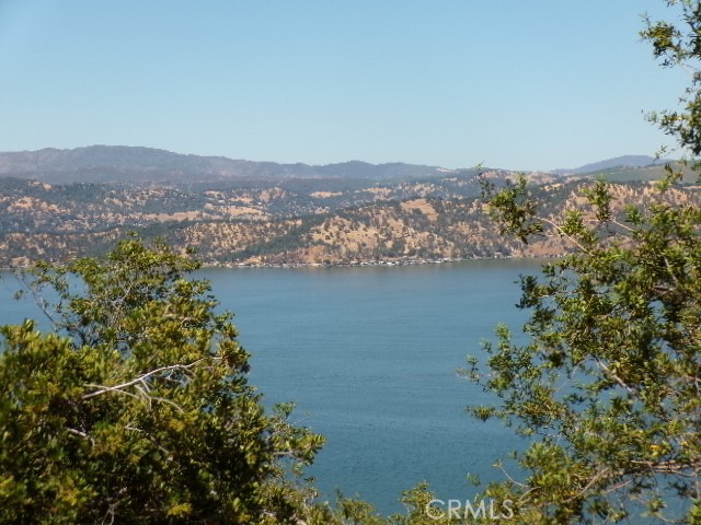 an aerial view of lake and residential houses with outdoor space