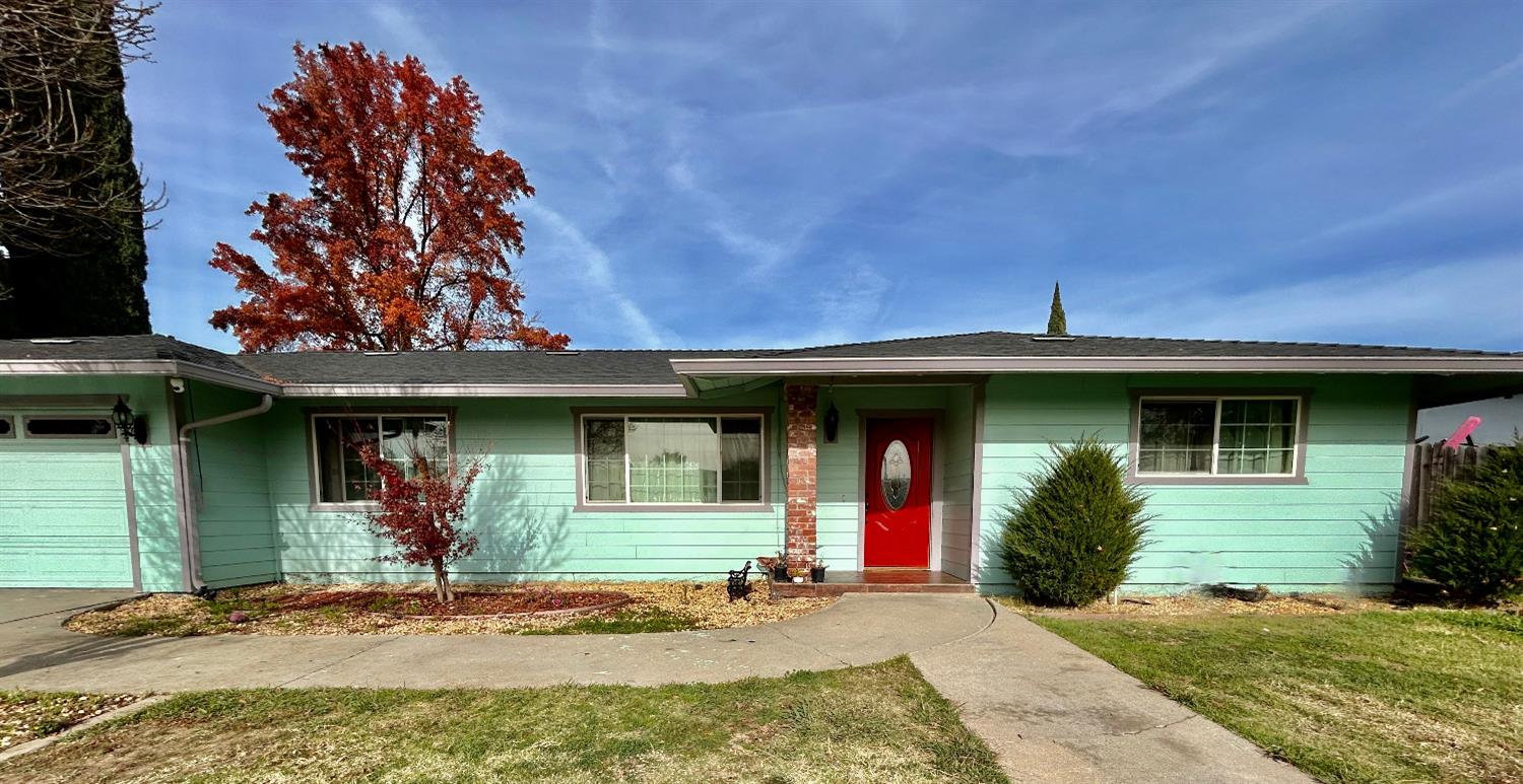 a front view of a house with garden