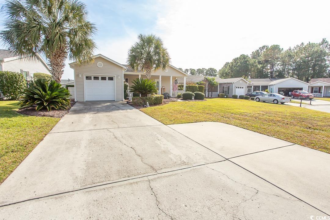 Single story home featuring a front yard