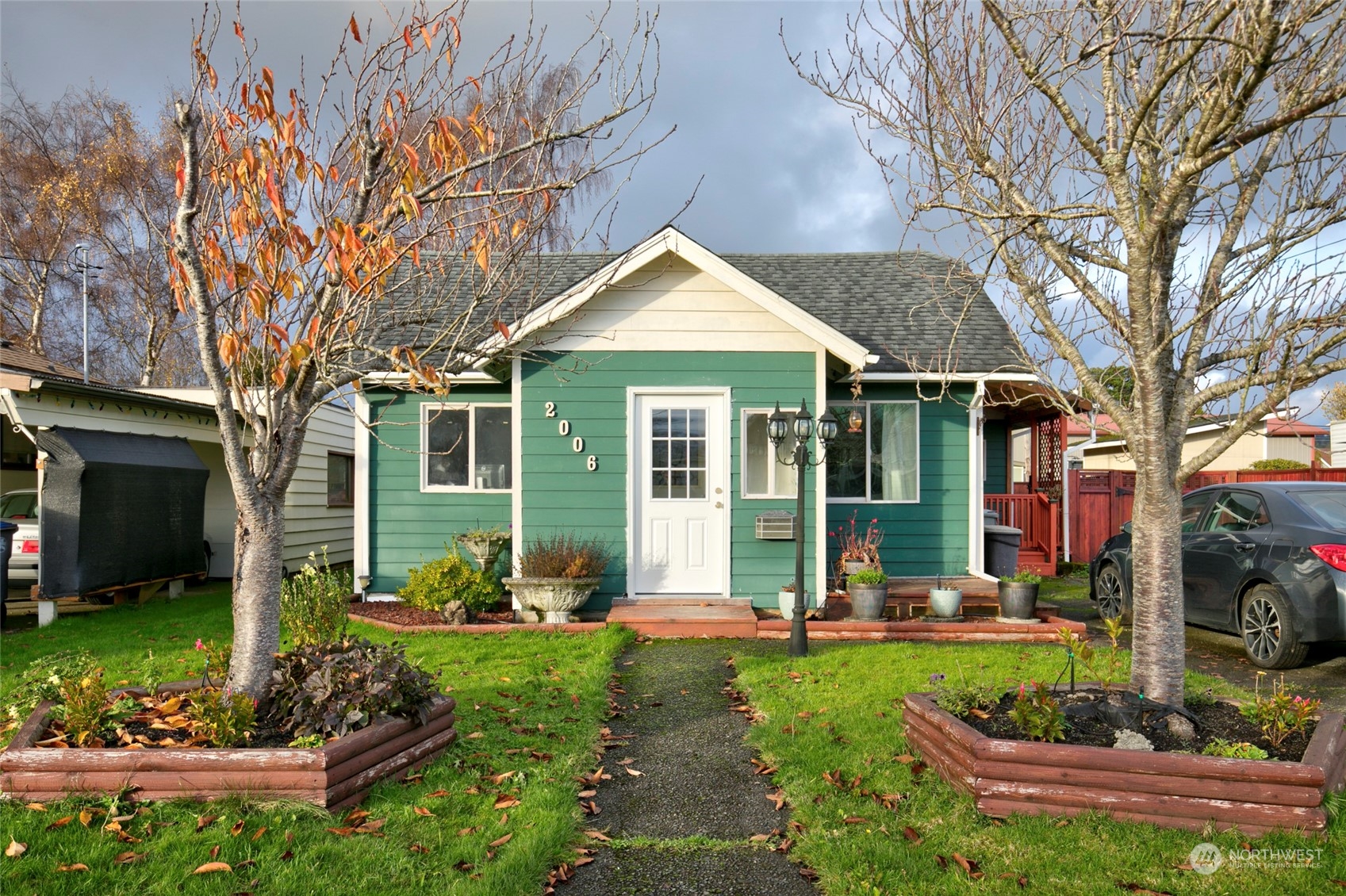 a front view of a house with garden