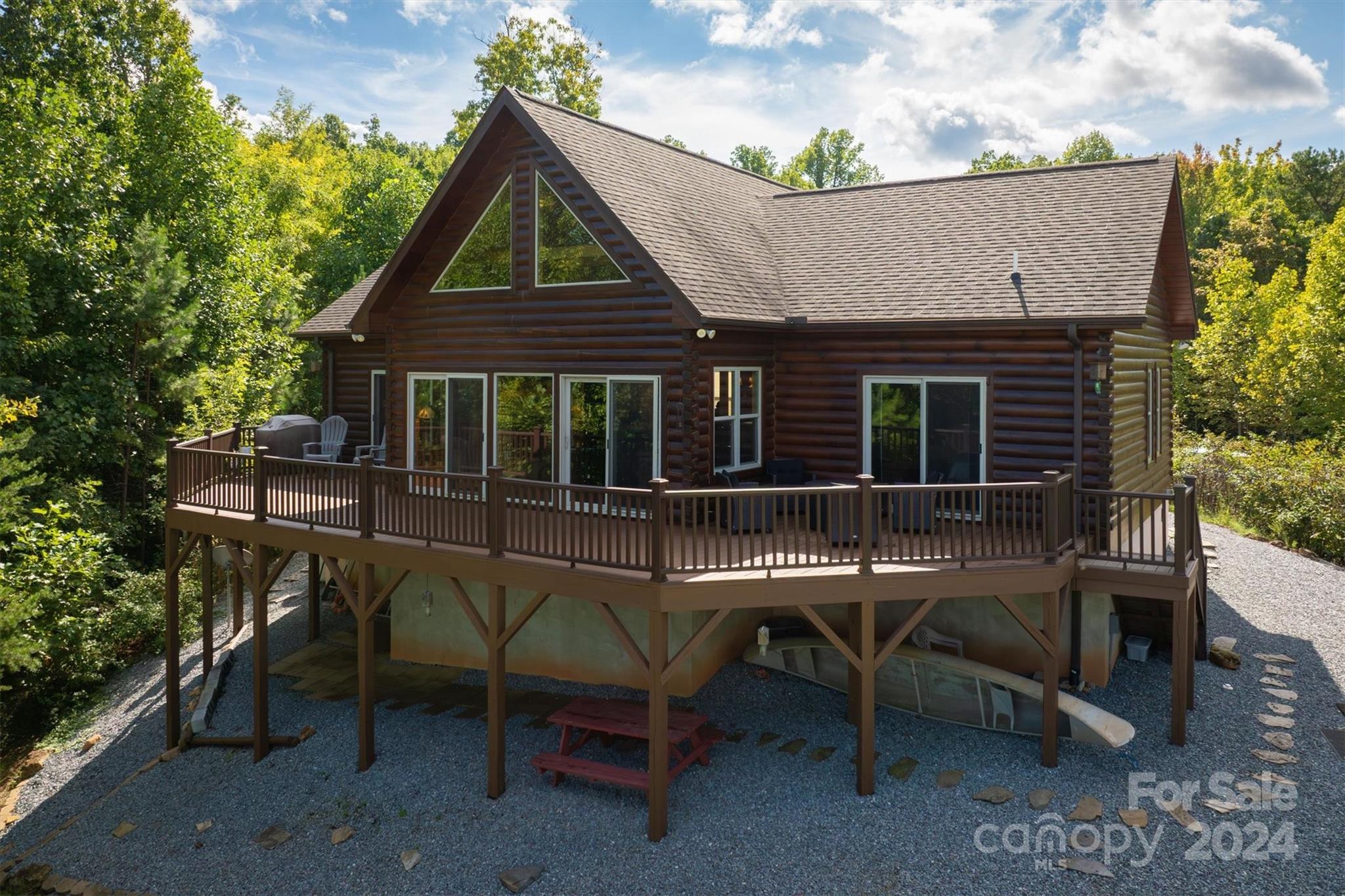 a view of house with outdoor seating