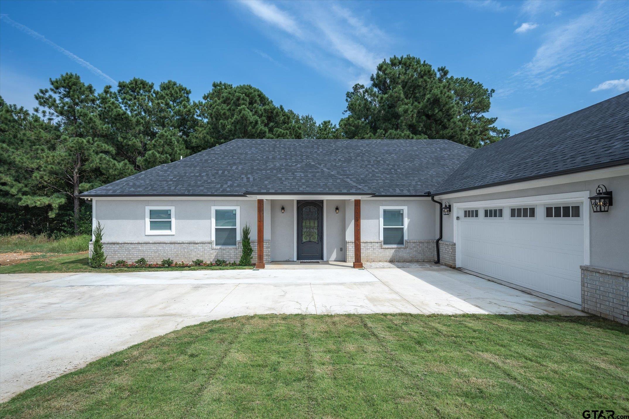 a house with trees in the background